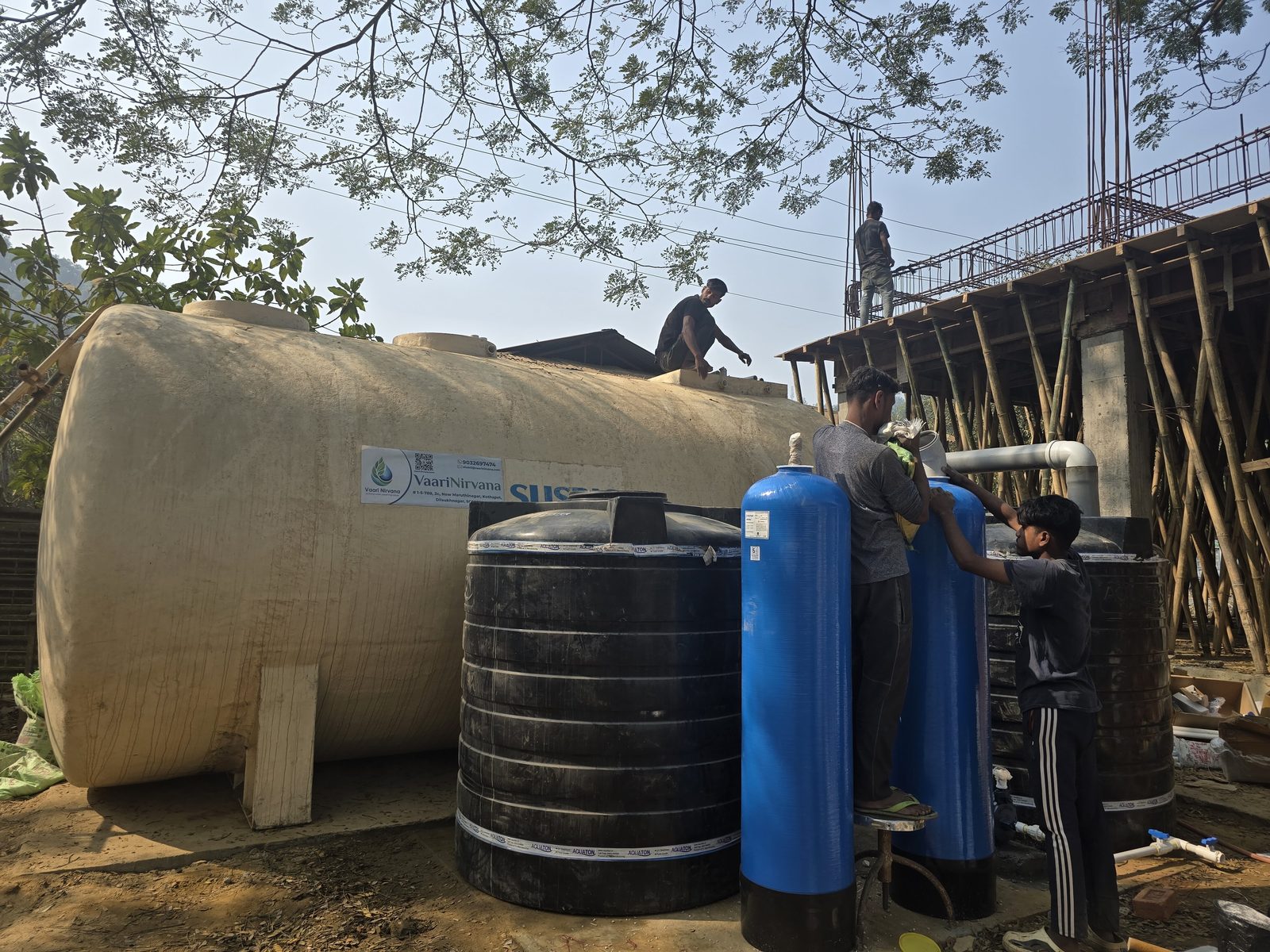 Technicians installing the pressure filters.