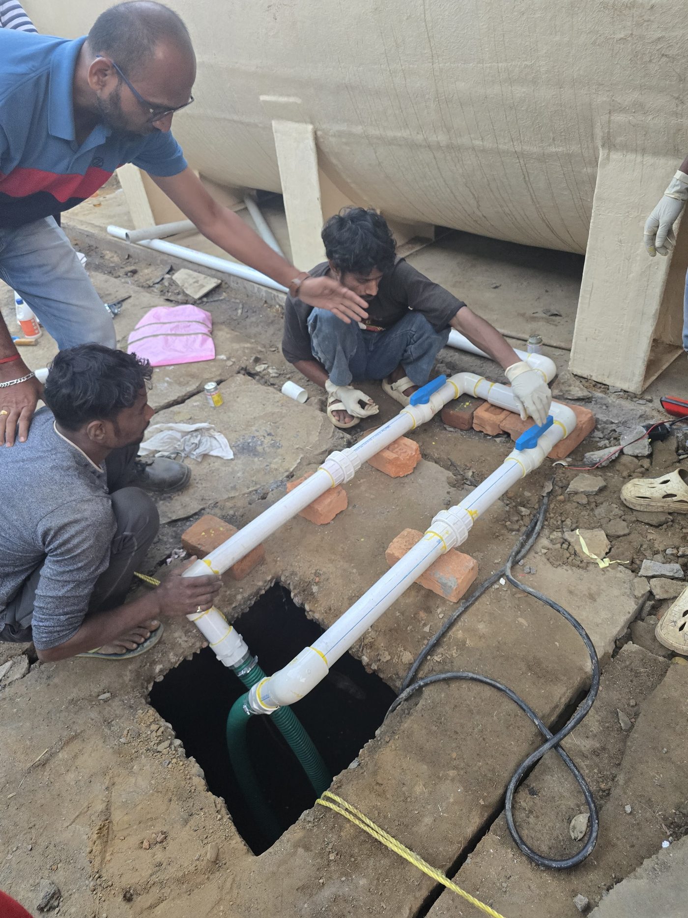 The team laying pipework into the inspection chamber.